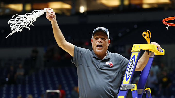 Houston head coach Kelvin Sampson cutting down the nets after defeating Tennessee in the 2025 Elite Eight. 