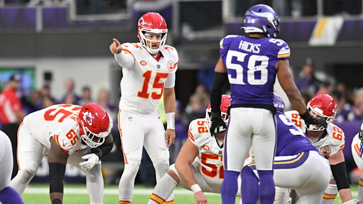 Oct 8, 2023; Minneapolis, Minnesota, USA; Kansas City Chiefs quarterback Patrick Mahomes (15) directs the offense as guard Trey Smith (65) and center Creed Humphrey (52) and Minnesota Vikings linebacker Jordan Hicks (58) look on during the fourth quarter at U.S. Bank Stadium. Mandatory Credit: Jeffrey Becker-Imagn Images