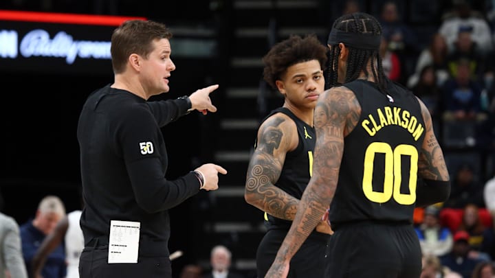 Nov 29, 2023; Memphis, Tennessee, USA; Utah Jazz head coach Will Hardy (left) talks with guard Keyonte George (middle) and guard Jordan Clarkson (00) during the first half against the Memphis Grizzlies  at FedExForum. Mandatory Credit: Petre Thomas-Imagn Images