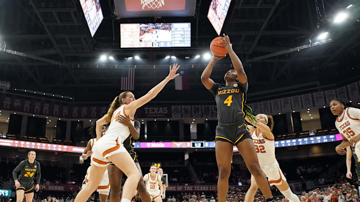 Jan 30, 2025; Austin, Texas, USA; Missouri Tigers forward Laniah Randle (4) shoots over Texas Longhorns forward Taylor Jones (44) during the first half at Moody Center. Mandatory Credit: Scott Wachter-Imagn Imagesl