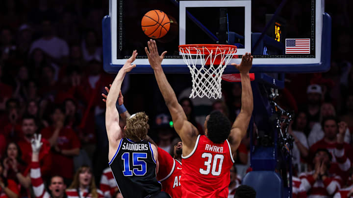 Feb 22, 2025; Tucson, Arizona, USA; Arizona Wildcats guard KJ Lewis (5) and forward Tobe Awaka (30) both fail to block BYU Cougars guard Richie Saunders (15) from a layup during the second half at McKale Center. Mandatory Credit: Aryanna Frank-Imagn Images Feb 22, 2025; Tucson, Arizona, USA; Arizona Wildcats guard KJ Lewis (5) and forward Tobe Awaka (30) both fail to block BYU Cougars guard Richie Saunders (15) from a layup during the second half at McKale Center. Mandatory Credit: Aryanna Frank-Imagn Images
