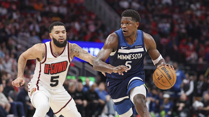 Dec 27, 2024; Houston, Texas, USA; Minnesota Timberwolves guard Anthony Edwards (5) controls the ball as Houston Rockets guard Fred VanVleet (5) defends during the first quarter at Toyota Center. Mandatory Credit: Troy Taormina-Imagn Images