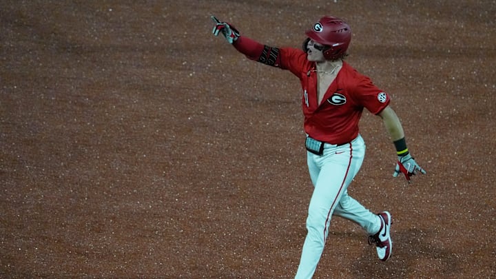 GeorgiaÕs Henry Hunter (11) celebrates after scoring a home run during a NCAA baseball game against Kentucky on March 14, 2025.
