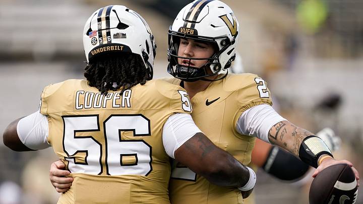 Vanderbilt quarterback Jared Curtis (2) hugs offensive lineman Lyndon Cooper (56) before a game against Delaware at FirstBank Stadium in Nashville, Tenn., Saturday, Sept. 12, 2026. Vanderbilt quarterback Jared Curtis (2) hugs offensive lineman Lyndon Cooper (56) before a game against Delaware at FirstBank Stadium in Nashville, Tenn., Saturday, Sept. 12, 2026.