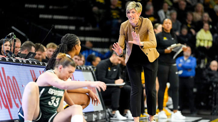Iowa head coach Jan Jensen talks to Iowa guard Journey Houston (8) before she subs into the game against the Michigan State Spartans Jan. 18, 2026 at Carver-Hawkeye Arena in Iowa City, Iowa.