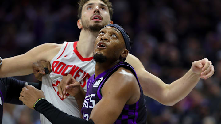 Dec 3, 2024; Sacramento, California, USA; Sacramento Kings center Isaac Jones (17) fights for a rebound against Houston Rockets center Alperen Sengun (28) during the third quarter at Golden 1 Center. Mandatory Credit: Sergio Estrada-Imagn Images