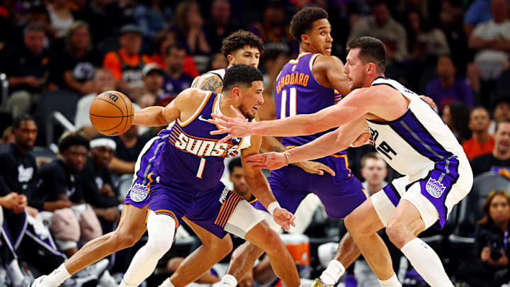 Oct 22, 2025; Phoenix, Arizona, USA; Phoenix Suns guard Devin Booker (1) handles the ball against Sacramento Kings forward Drew Eubanks (19) during the second half at the Mortgage Matchup Center. Mandatory Credit: Mark J. Rebilas-Imagn Images Oct 22, 2025; Phoenix, Arizona, USA; Phoenix Suns guard Devin Booker (1) handles the ball against Sacramento Kings forward Drew Eubanks (19) during the second half at the Mortgage Matchup Center. Mandatory Credit: Mark J. Rebilas-Imagn Images
