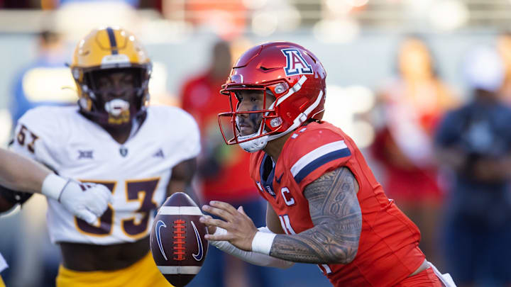 Nov 30, 2024; Tucson, Arizona, USA; Arizona Wildcats quarterback Noah Fifita (11) against the Arizona State Sun Devils during the Territorial Cup at Arizona Stadium. Mandatory Credit: Mark J. Rebilas-Imagn Images Nov 30, 2024; Tucson, Arizona, USA; Arizona Wildcats quarterback Noah Fifita (11) against the Arizona State Sun Devils during the Territorial Cup at Arizona Stadium. Mandatory Credit: Mark J. Rebilas-Imagn Images