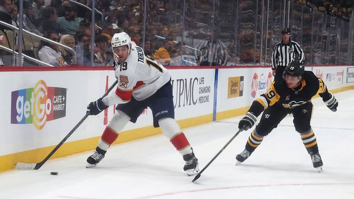 Oct 22, 2026; Pittsburgh, Pennsylvania, USA; Florida Panthers left wing Matthew Tkachuk (19) moves the puck against Pittsburgh Penguins center Connor Dewar (19) during the second period at PPG Paints Arena. Mandatory Credit: Charles LeClaire-Imagn Images Oct 22, 2026; Pittsburgh, Pennsylvania, USA; Florida Panthers left wing Matthew Tkachuk (19) moves the puck against Pittsburgh Penguins center Connor Dewar (19) during the second period at PPG Paints Arena. Mandatory Credit: Charles LeClaire-Imagn Images