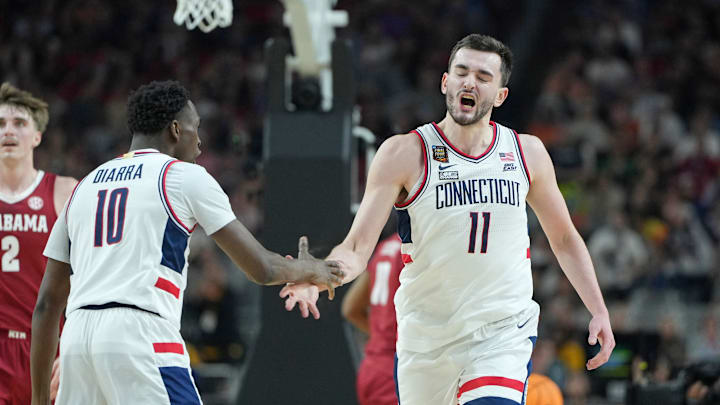 Apr 6, 2024; Glendale, AZ, USA; Connecticut Huskies forward Alex Karaban (11) celebrates after a