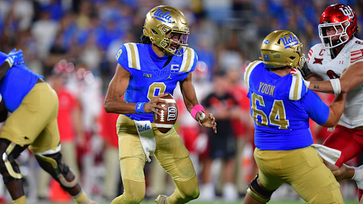 Aug 30, 2025; Pasadena, California, USA; UCLA Bruins quarterback Nico Iamaleava (9) moves out to pass as offensive lineman Sam Yoon (64) provides coverage against Utah Utes linebacker Lander Barton (8) during the second half at Rose Bowl. Mandatory Credit: Gary A. Vasquez-Imagn Images Aug 30, 2025; Pasadena, California, USA; UCLA Bruins quarterback Nico Iamaleava (9) moves out to pass as offensive lineman Sam Yoon (64) provides coverage against Utah Utes linebacker Lander Barton (8) during the second half at Rose Bowl. Mandatory Credit: Gary A. Vasquez-Imagn Images