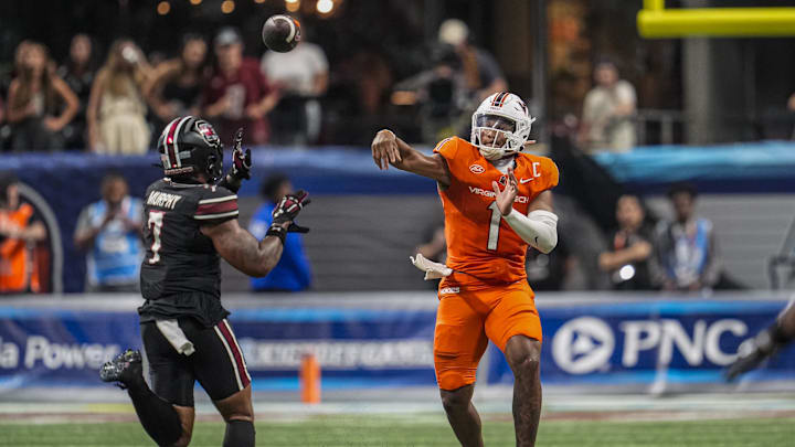 Aug 31, 2025; Atlanta, Georgia, USA; Virginia Tech Hokies quarterback Kyron Drones (1) passes over South Carolina Gamecocks linebacker Shawn Murphy (7) during the second half at Mercedes-Benz Stadium. Mandatory Credit: Dale Zanine-Imagn Images Aug 31, 2025; Atlanta, Georgia, USA; Virginia Tech Hokies quarterback Kyron Drones (1) passes over South Carolina Gamecocks linebacker Shawn Murphy (7) during the second half at Mercedes-Benz Stadium. Mandatory Credit: Dale Zanine-Imagn Images