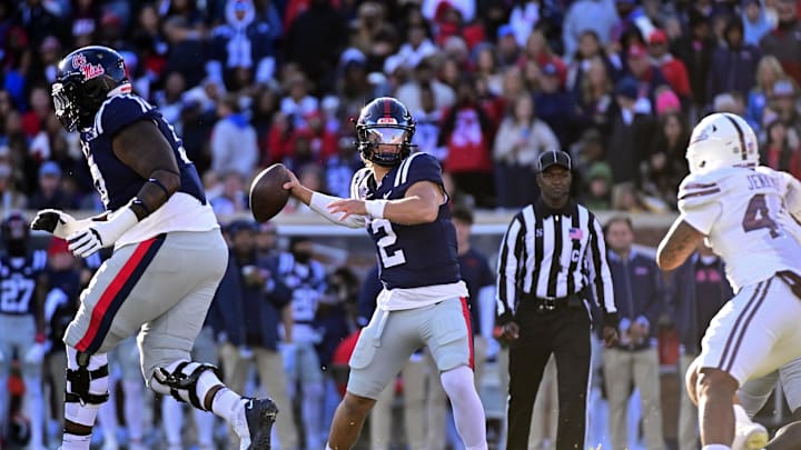Nov 29, 2024; Oxford, Mississippi, USA; Mississippi Rebels quarterback Jaxson Dart (2) looks to pass while defended by Mississippi State Bulldogs linebacker Branden Jennings (44) during the first quarter at Vaught-Hemingway Stadium. Mandatory Credit: Matt Bush-Imagn Images Nov 29, 2024; Oxford, Mississippi, USA; Mississippi Rebels quarterback Jaxson Dart (2) looks to pass while defended by Mississippi State Bulldogs linebacker Branden Jennings (44) during the first quarter at Vaught-Hemingway Stadium. Mandatory Credit: Matt Bush-Imagn Images