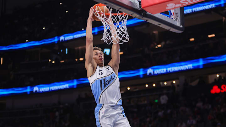 Mar 23, 2025; Atlanta, Georgia, USA; Atlanta Hawks guard Dyson Daniels (5) attempts a dunk against the Philadelphia 76ers in the third quarter at State Farm Arena. Mandatory Credit: Brett Davis-Imagn Images