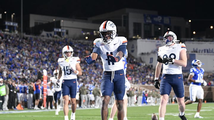 Nov 15, 2025; Durham, North Carolina, USA;  Virginia Cavaliers wide receiver Trell Harris (11) celebrates a touchdown against the Duke Blue Devils in the third quarter at Wallace Wade Stadium. Mandatory Credit: Zachary Taft-Imagn Images