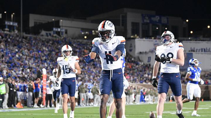 Nov 15, 2025; Durham, North Carolina, USA;  Virginia Cavaliers wide receiver Trell Harris (11) celebrates a touchdown against the Duke Blue Devils in the third quarter at Wallace Wade Stadium. Mandatory Credit: Zachary Taft-Imagn Images
