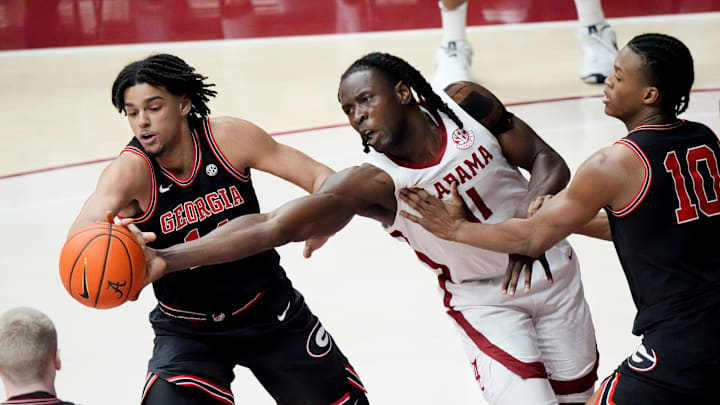 Feb 1, 2025; Tuscaloosa, AL, USA; Alabama center Clifford Omoruyi (11) and Georgia forward Asa Newell (14) attempt to gain control of a rebound at Coleman Coliseum. Mandatory Credit: Gary Cosby Jr.-Tuscaloosa News