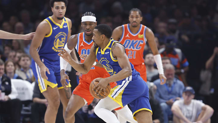Nov 10, 2024; Oklahoma City, Oklahoma, USA; Golden State Warriors guard De'Anthony Melton (8) drives to the basket beside Oklahoma City Thunder guard Shai Gilgeous-Alexander (2) during the first quarter at Paycom Center. Mandatory Credit: Alonzo Adams-Imagn Images