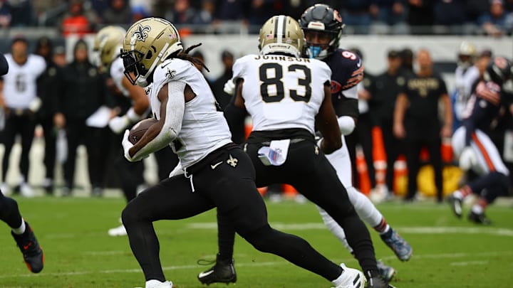 Oct 19, 2025; Chicago, Illinois, USA; New Orleans Saints running back Alvin Kamara (41) rushes the ball against the Chicago Bears during the first quarter at Soldier Field. Mandatory Credit: Mike Dinovo-Imagn Images