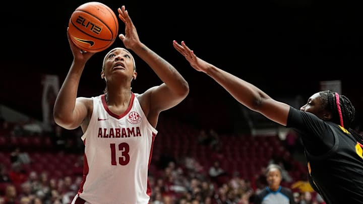 Jan 5, 2025; Tuscaloosa, AL, USA; Alabama center JeAnna Cunningham (13) goes to the basket with Missouri forward Laniah Randle (4) defending at Coleman Coliseum.