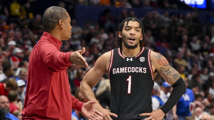 Mar 12, 2025; Nashville, TN, USA;  South Carolina Gamecocks head coach Lamont Paris talks with guard Jacobi Wright (1) during a break in action during the second half at Bridgestone Arena. Mandatory Credit: Steve Roberts-Imagn Images