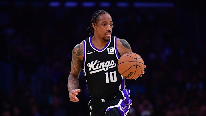 Dec 28, 2024; Los Angeles, California, USA; Sacramento Kings forward DeMar DeRozan (10) moves the ball up court aganst the Los Angeles Lakers during the first half at Crypto.com Arena. Mandatory Credit: Gary A. Vasquez-Imagn Images