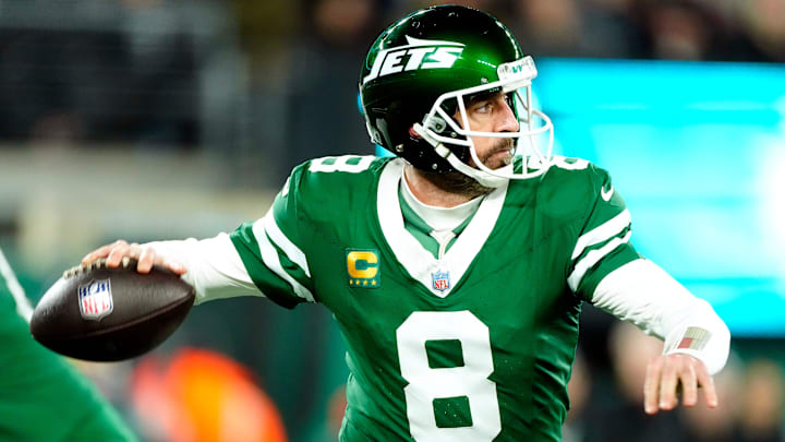 New York Jets quarterback Aaron Rodgers throws a pass.