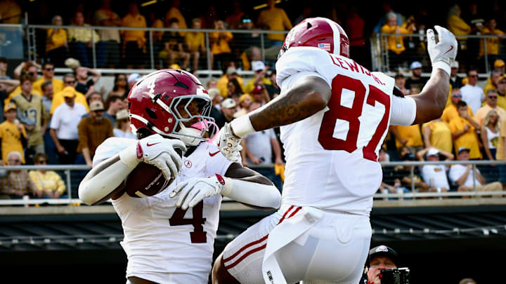 Daniel Hill celebrates with Danny Lewis Jr. after making the go-ahead touchdown reception against the Missouri Tigers.