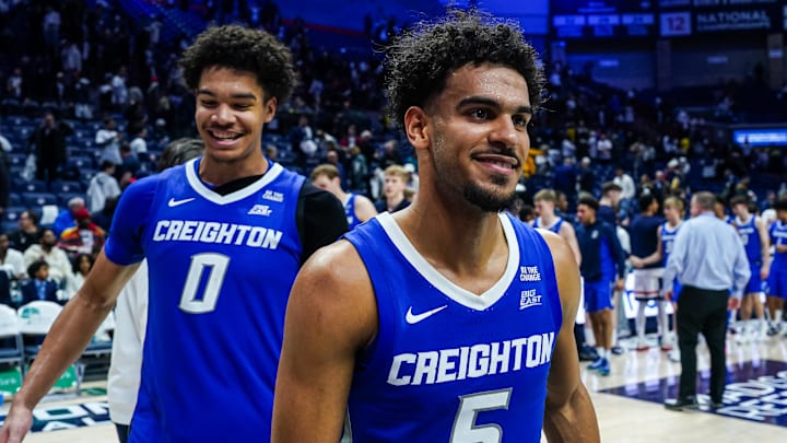 Feb 18, 2026; Storrs, Connecticut, USA; Creighton Bluejays guard Nik Graves (5) and forward Jasen Green (0) react after defeating the UConn Huskies at Harry A. Gampel Pavilion. Mandatory Credit: David Butler II-Imagn Images