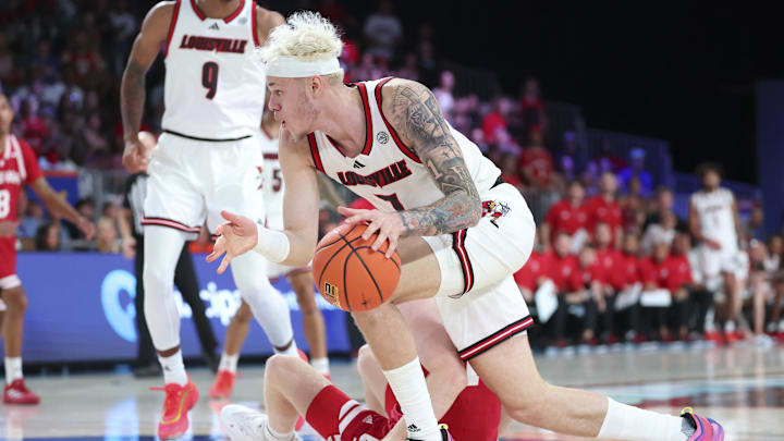 Nov 27, 2024; Paradise Island, Bahamas, BHS; Indiana Hoosiers forward Luke Goode (10) and Louisville Cardinals forward Kasean Pryor (7) go for a loose ball during the first half at the Atlantis Resort.  