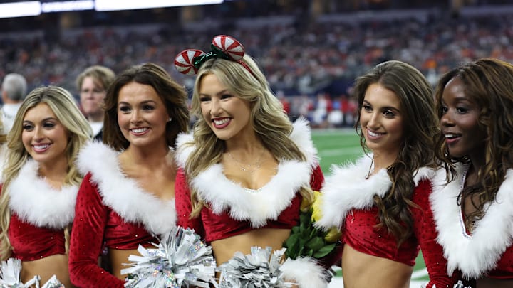 Dec 22, 2024; Arlington, Texas, USA; Dallas Cowboys cheerleaders pose on the sidelines during the game against the Tampa Bay Buccaneers. Dec 22, 2024; Arlington, Texas, USA; Dallas Cowboys cheerleaders pose on the sidelines during the game against the Tampa Bay Buccaneers.