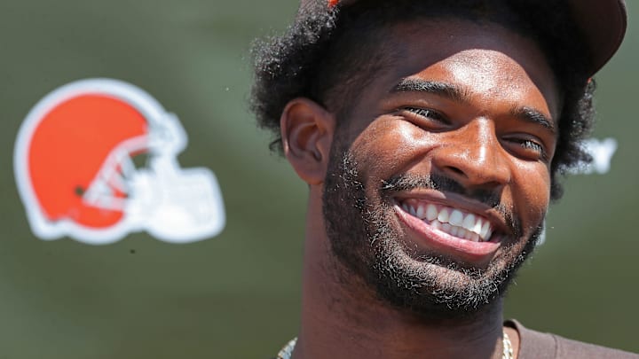 Cleveland Browns quarterback Shedeur Sanders (12) is all smiles as he reflects on his first day of practice during a press conference before day two of NFL rookie minicamp at the Cleveland Browns training facility on Saturday, May 10, 2025, in Berea, Ohio.