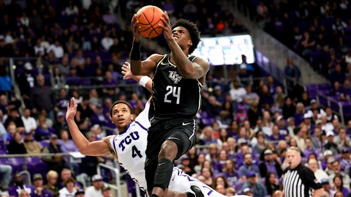 Mar 9, 2024; Fort Worth, Texas, USA;  UCF Knights guard Jaylin Sellers (24) shoots past TCU Horned Frogs guard Jameer Nelson Jr. (4) during the second half at Ed and Rae Schollmaier Arena. Mandatory Credit: Kevin Jairaj-USA TODAY Sports