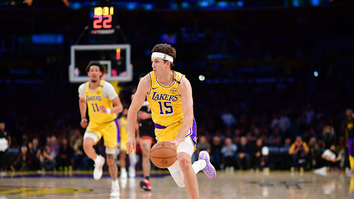 January 15, 2025; Los Angeles, California, USA; Los Angeles Lakers guard Austin Reaves (15) moves the ball against the Miami Heat during the second half at Crypto.com Arena. Mandatory Credit: Gary A. Vasquez-Imagn Images