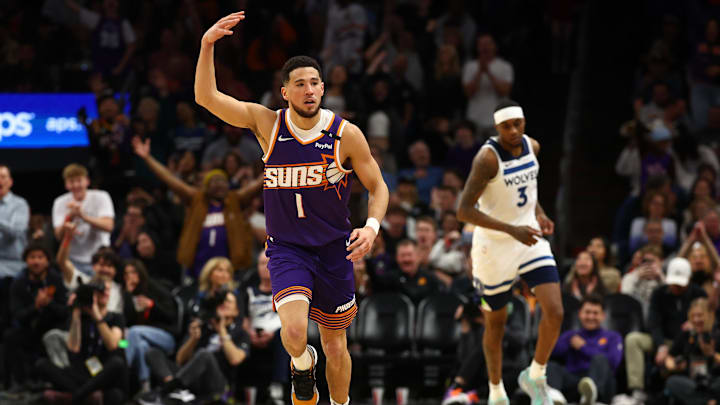 Jan 29, 2025; Phoenix, Arizona, USA; Phoenix Suns guard Devin Booker (1) reacts against the Minnesota Timberwolves in the first half at Footprint Center. Mandatory Credit: Mark J. Rebilas-Imagn Images