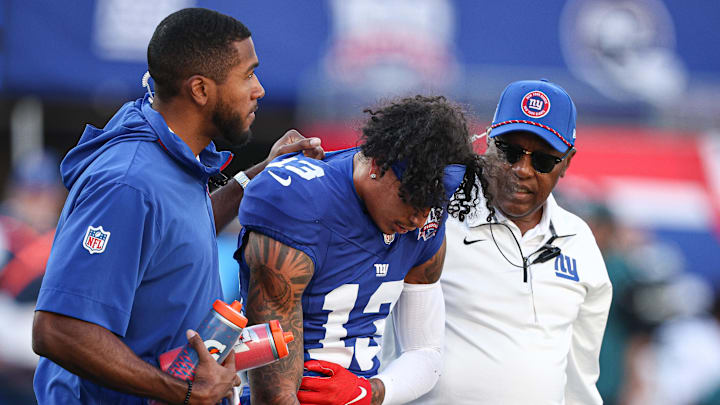 Oct 20, 2024; East Rutherford, New Jersey, USA; New York Giants wide receiver Jalin Hyatt (13) walks off the field after an injury during the second half against the Philadelphia Eagles at MetLife Stadium.  