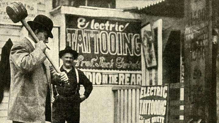 Man playing a game at a fairground in the early 1900s Man playing a game at a fairground in the early 1900s