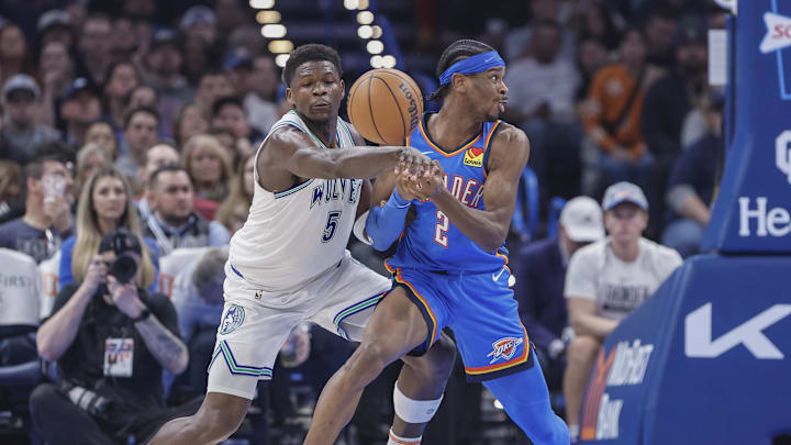 Jan 29, 2024; Oklahoma City, Oklahoma, USA; Minnesota Timberwolves guard Anthony Edwards (5) forces a turn over by Oklahoma City Thunder guard Shai Gilgeous-Alexander (2) during the second quarter at Paycom Center. Mandatory Credit: Alonzo Adams-Imagn Images
