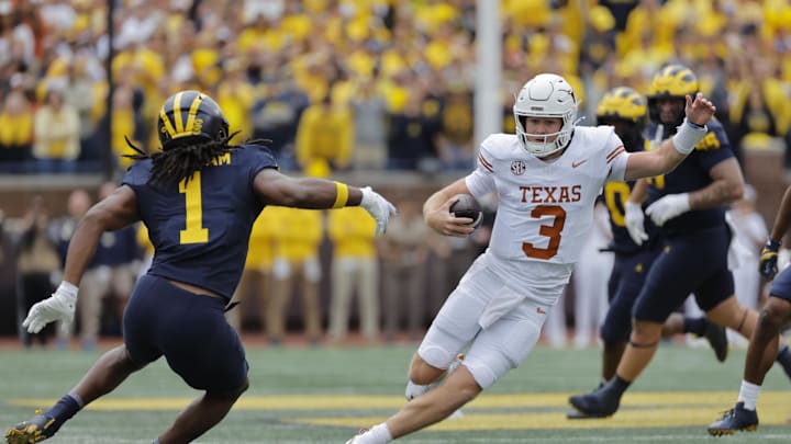 Sep 7, 2024; Ann Arbor, Michigan, USA; Texas Longhorns quarterback Quinn Ewers (3) rushes in the first half against the Michigan Wolverines at Michigan Stadium. Mandatory Credit: Rick Osentoski-Imagn Images