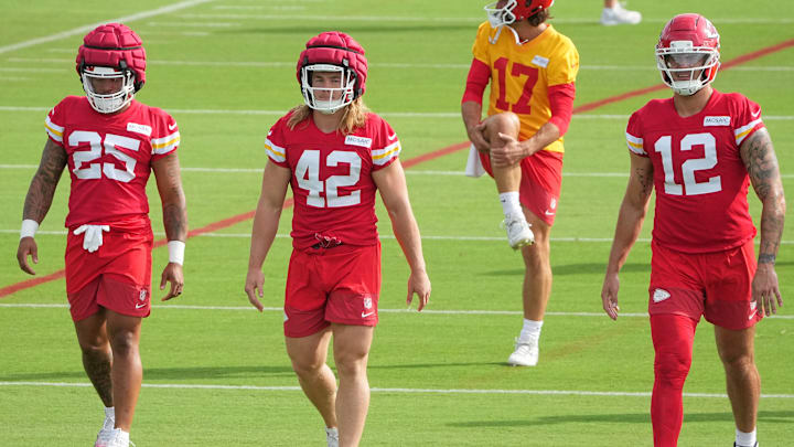 Jul 22, 2025; St. Joseph, MO, USA; Kansas City Chiefs running back Elijah Mitchell (25) and running back Carson Steele (42) and tight end Jared Wiley (12) on field during training camp at Missouri Western State University. Mandatory Credit: Denny Medley-Imagn Images