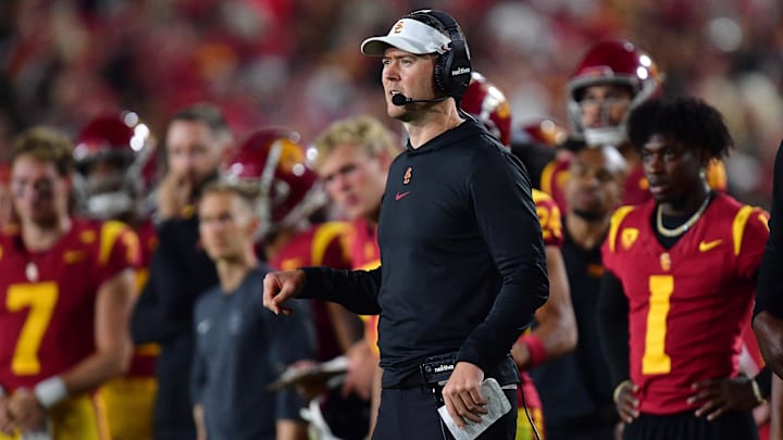 Oct 7, 2023; Los Angeles, California, USA; Southern California Trojans head coach Lincoln Riley watches game action against the Arizona Wildcats during the second half at Los Angeles Memorial Coliseum. Mandatory Credit: Gary A. Vasquez-Imagn Images Oct 7, 2023; Los Angeles, California, USA; Southern California Trojans head coach Lincoln Riley watches game action against the Arizona Wildcats during the second half at Los Angeles Memorial Coliseum. Mandatory Credit: Gary A. Vasquez-Imagn Images