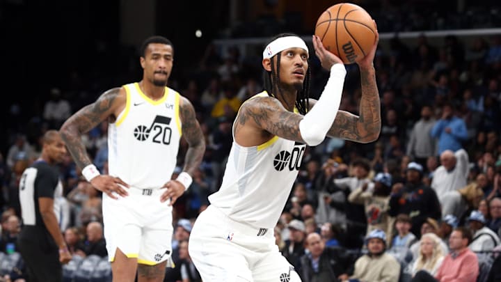 Nov 10, 2023; Memphis, Tennessee, USA; Utah Jazz guard Jordan Clarkson (0) shoots free throws after Memphis Grizzlies forward-center Jaren Jackson Jr. (not pictured) was called for two technical fouls during the second half at FedExForum. Mandatory Credit: Petre Thomas-Imagn Images 