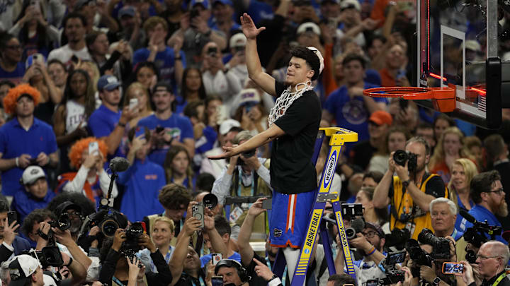 Apr 7, 2025; San Antonio, TX, USA; Florida Gators guard Walter Clayton Jr. (1) cuts the net after defeating the Houston Cougars in the national championship game of the Final Four of the 2025 NCAA Tournament at the Alamodome.Mandatory Credit: Scott Wachter-Imagn Images