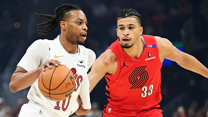 Mar 2, 2025; Cleveland, Ohio, USA; Cleveland Cavaliers guard Darius Garland (10) drives to the basket against Portland Trail Blazers forward Toumani Camara (33) during the first half at Rocket Arena. Mandatory Credit: Ken Blaze-Imagn Images