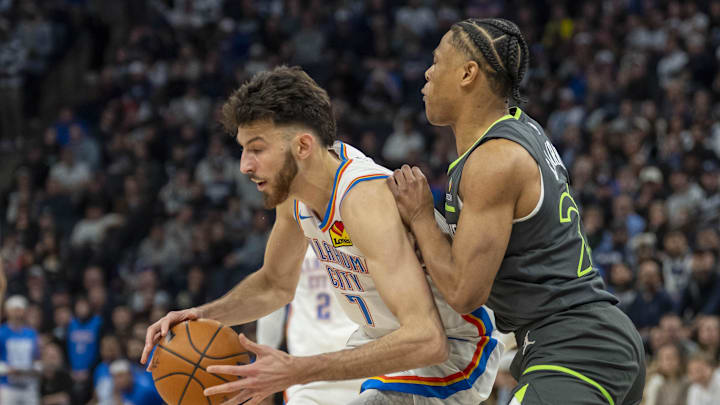 Feb 23, 2025; Minneapolis, Minnesota, USA; Oklahoma City Thunder forward Chet Holmgren (7) backs towards the basket as Minnesota Timberwolves guard Jaylen Clark (22) plays defense in the first half at Target Center. Mandatory Credit: Jesse Johnson-Imagn Images