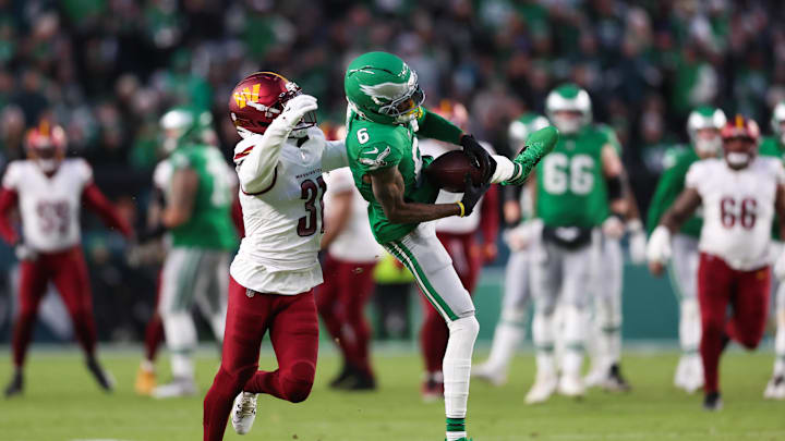Jan 4, 2026; Philadelphia, Pennsylvania, USA; Philadelphia Eagles wide receiver Devonta Smith (6) makes a catch as Washington Commanders cornerback Jonathan Jones (31) defends during the second quarter at Lincoln Financial Field. 