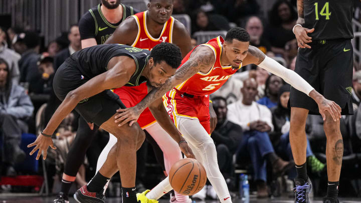 Mar 10, 2024; Atlanta, Georgia, USA; New Orleans Pelicans forward Herbert Jones (5) gets the ball away from Atlanta Hawks guard Dejounte Murray (5) during the second half at State Farm Arena. Mandatory Credit: Dale Zanine-USA TODAY Sports