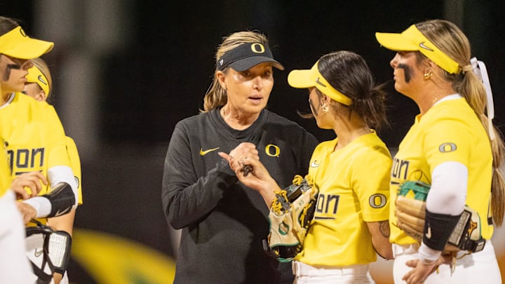 Oregon coach Melyssa Lombardi talks to players as the Oregon Ducks host the UCLA Bruins on April 18, 2025, at Jane Sanders Stadium in Eugene.