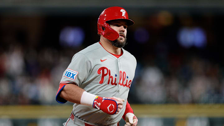 Philadelphia Phillies designated hitter Kyle Schwarber (12) rounds the bases on a solo home run in the seventh inning against the Colorado Rockies at Coors Field on May 20.