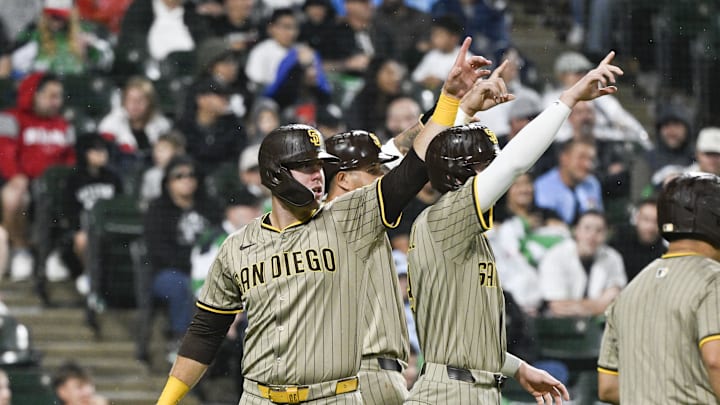 Sep 20, 2025; Chicago, Illinois, USA; San Diego Padres outfielders Jackson Merrill (3), Jackson Merrill (3) and and Gavin Sheets (30) point towards first baseman Ryan O'Hearn (32) after scoring on his three run double against the Chicago White Sox during the sixth inning at Rate Field. Mandatory Credit: Matt Marton-Imagn Images Sep 20, 2025; Chicago, Illinois, USA; San Diego Padres outfielders Jackson Merrill (3), Jackson Merrill (3) and and Gavin Sheets (30) point towards first baseman Ryan O'Hearn (32) after scoring on his three run double against the Chicago White Sox during the sixth inning at Rate Field. Mandatory Credit: Matt Marton-Imagn Images